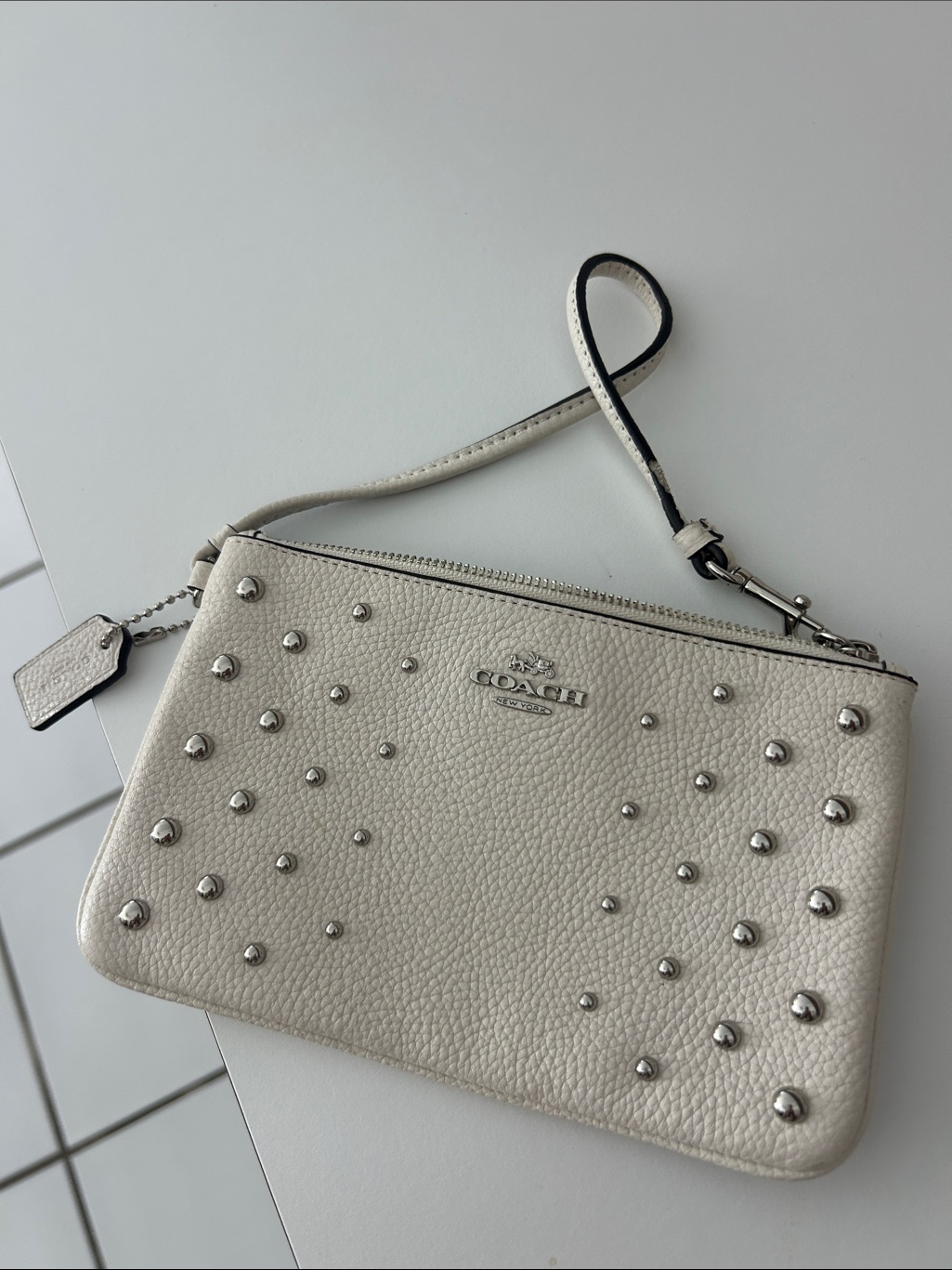 Coach Pebbled Leather Wristlet In Off-White With Silver Studs